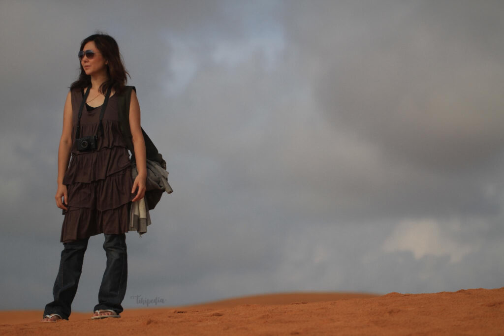 Walking on the Red Sand Dunes, Muine, Vietnam.